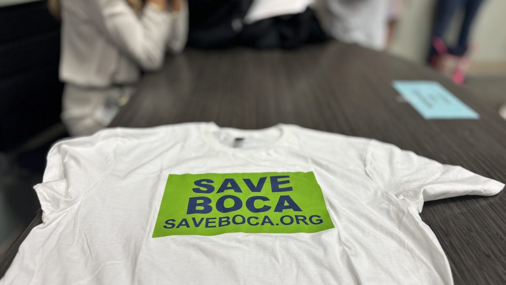 'Save Boca' tee shirts at the July 15, 2025 city council meeting. (Photo: Boca Daily News)